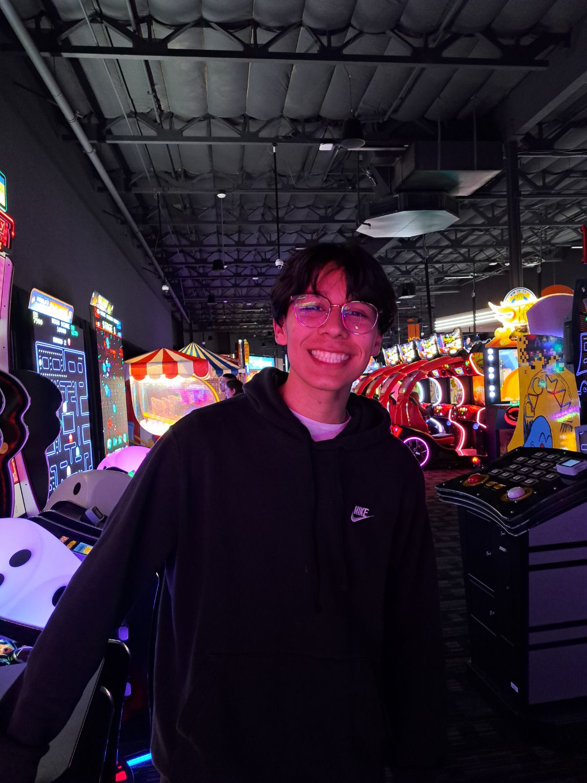 Image of Francisco Irazaba in front of an arcade